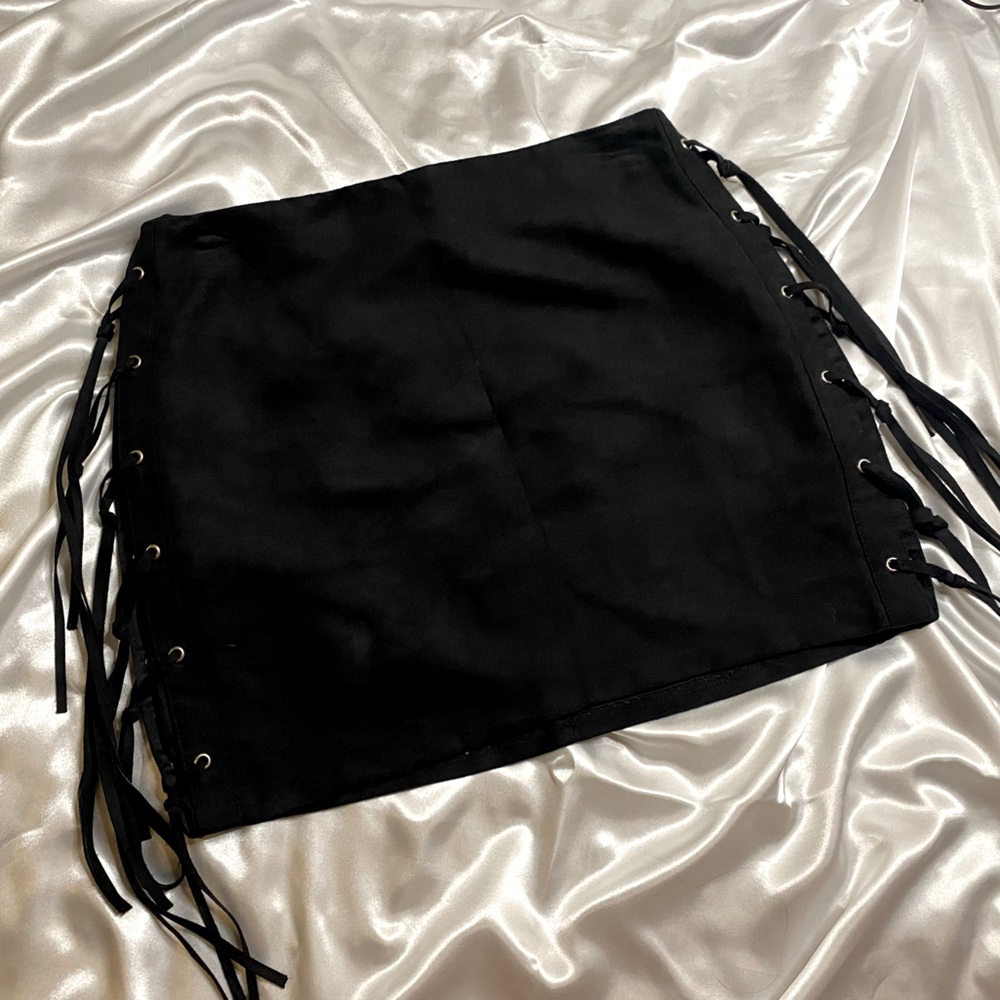 Black Skirt with fringe on sides. Size: M
